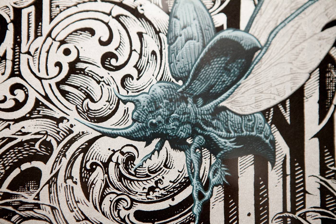 An ornate black-and-white swirling illustration featuring a stylized moth, titled 'The Gilded Age'