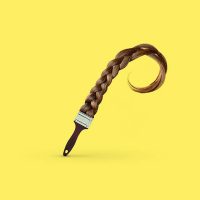 A curled, brush-like object against a bright yellow background, from Daniel Forero's conceptual experimental projects