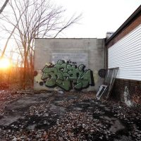 An abandoned graffiti-covered building at sunrise, from 'Scene Report: Detroit'
