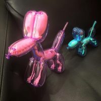 Sculpture of pink and teal balloon dog shapes