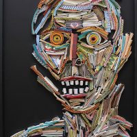 Mosaic-style collage portrait of a distorted face made of colorful strips