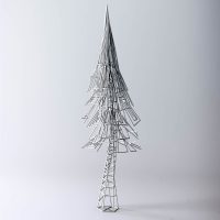 Wireframe sculpture of a tall, thin conical tree or spire in silver wire mesh