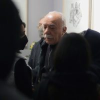 Two visitors in conversation at Abdolhossein Pazoki's exhibition at Aliha Gallery, 2021